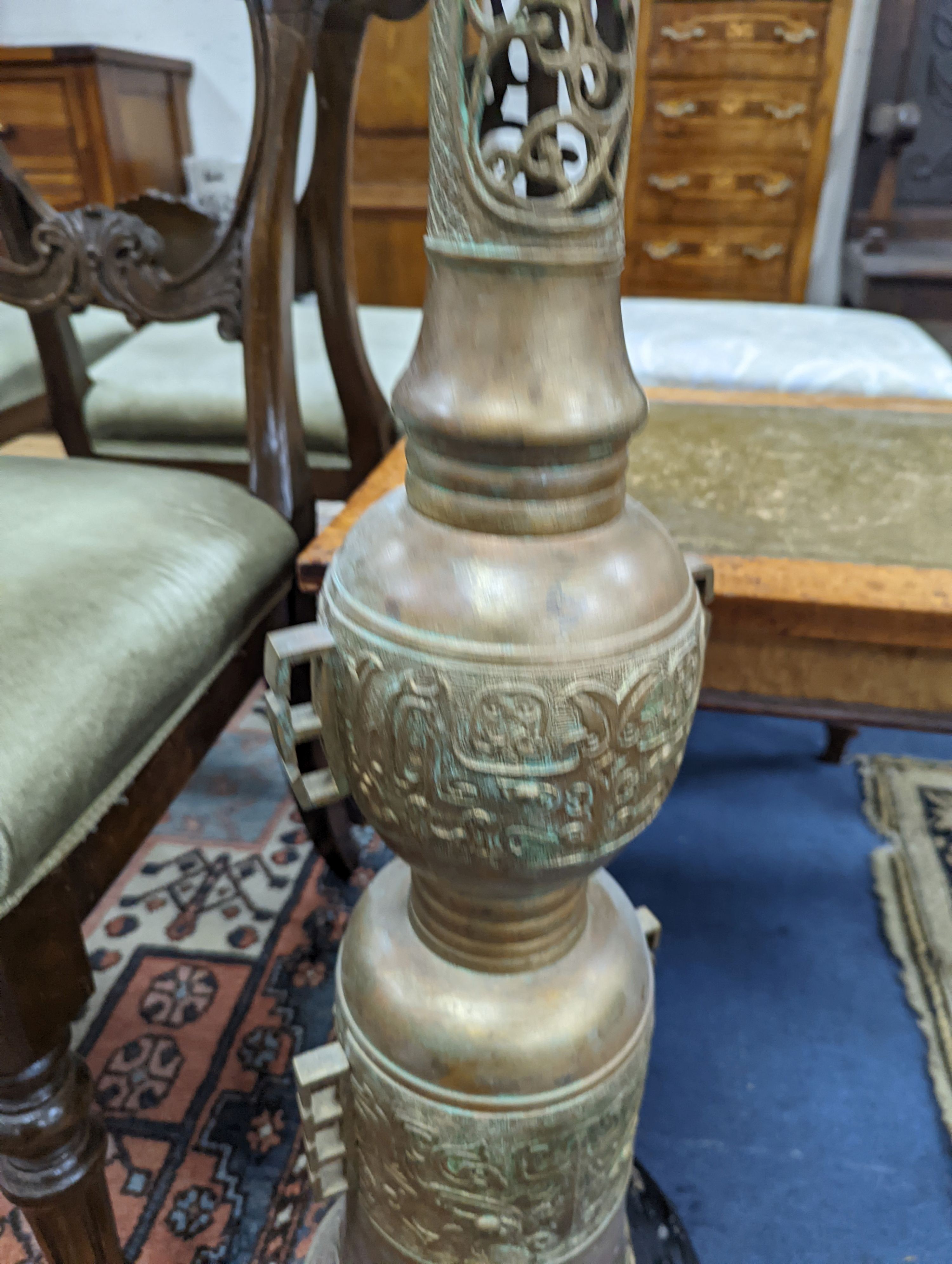 A bronze floor lamp